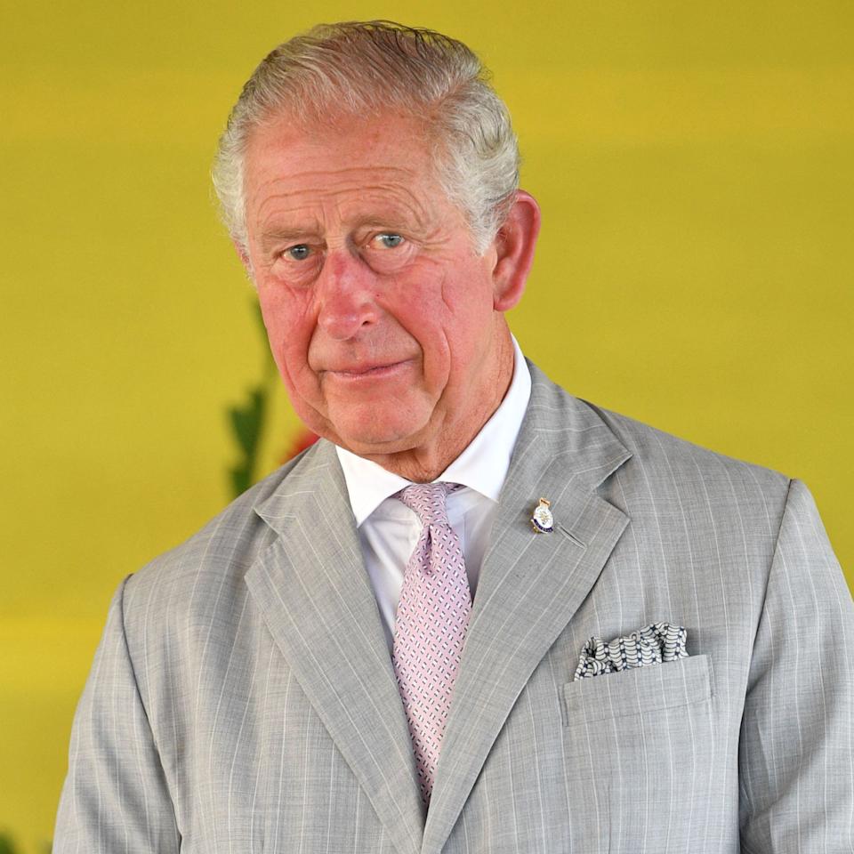 King Charles wears a gray suit and looks pensive, Princess Beatrice and Princess Eugenie pose on the red carpet.