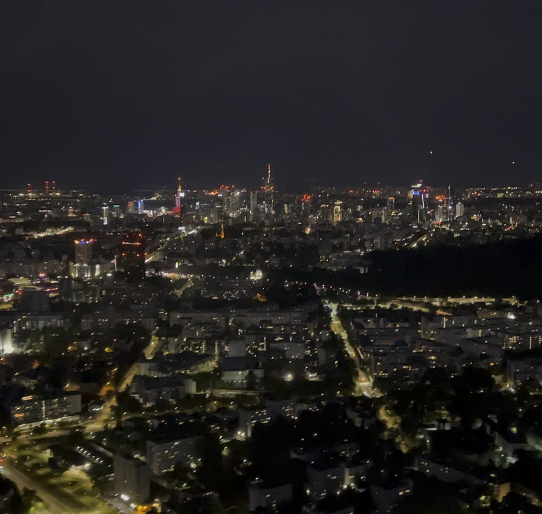 Night helicopter flight over Warsaw city