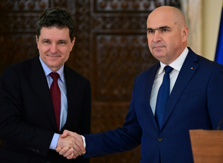 Nicusor Dan (L) said Ilie Bolojan (R) was