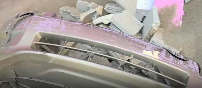 Bumper left behind after vehicle crashes through wall of business