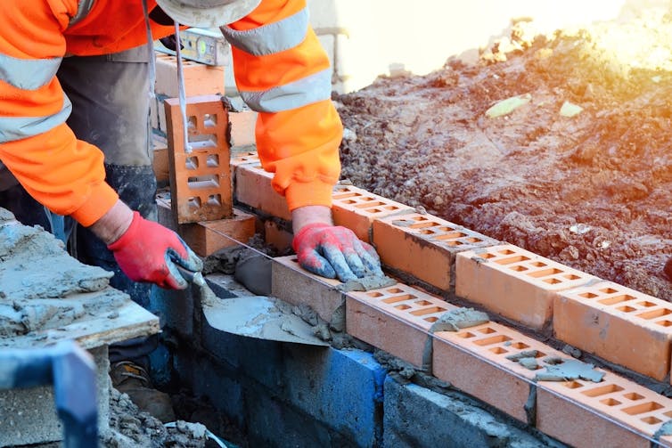 bricklayer working on a building site.