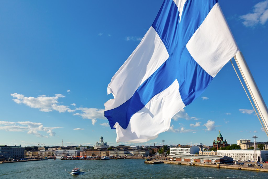 Finnish flag waving over Helsinki.