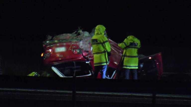 Footage from the scene showed an upturned red car.