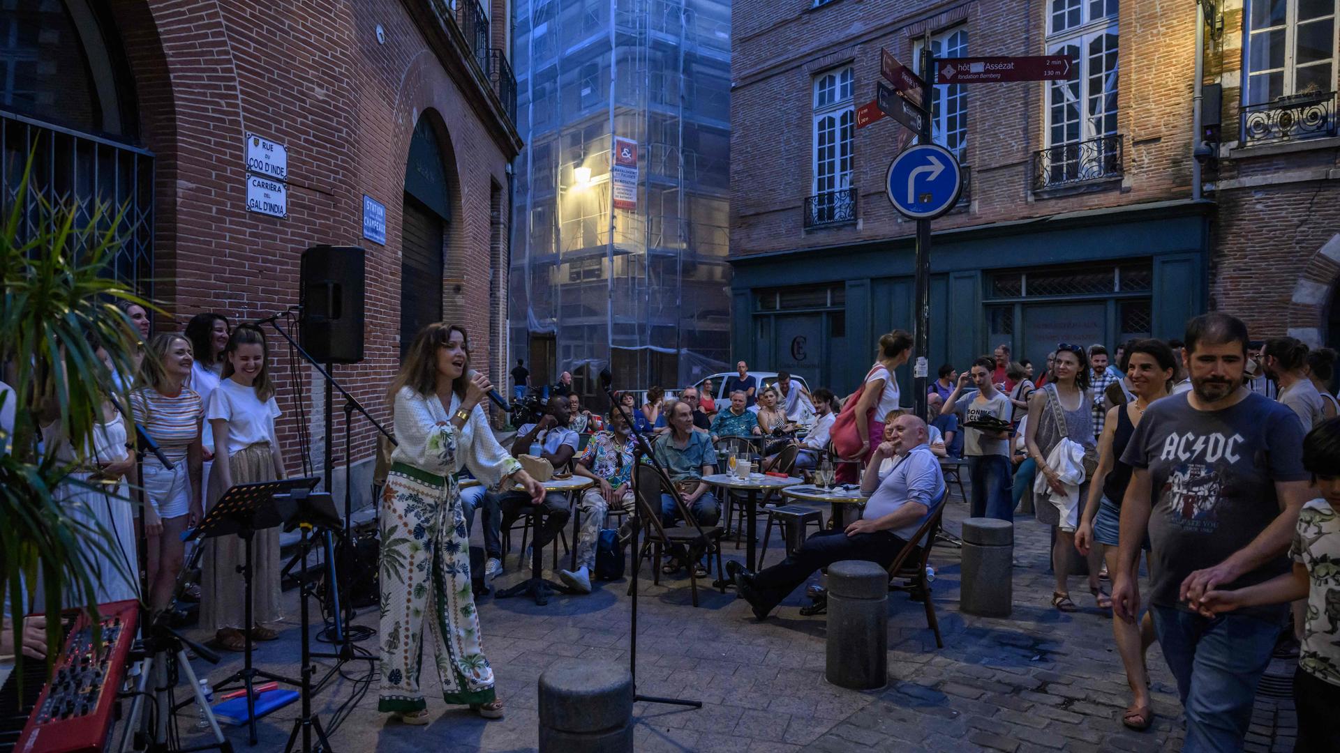 Musicians play on a street during France's annual street music festival "Fete de la Musique" in Toulouse on June 21, 2025. (Photo by Ed JONES / AFP)
