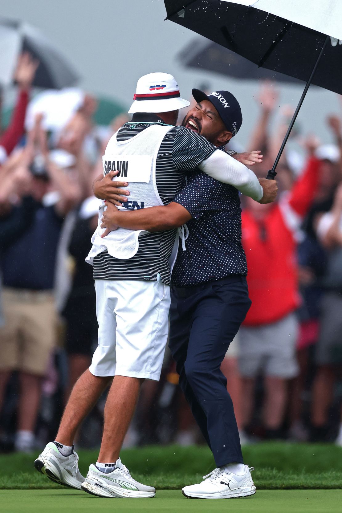 JJ Spaun with caddie Mark Carens after winning on the 18th green during the final round of the 125th U.S. Open.