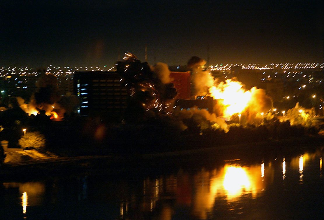 Bombs fall on government buildings located in the heart of Baghdad along the Tigris River on March 20, 2003.