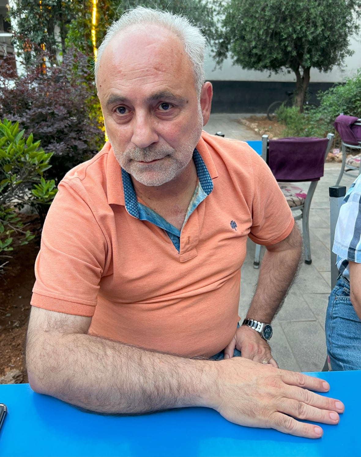 A person sits at a table.