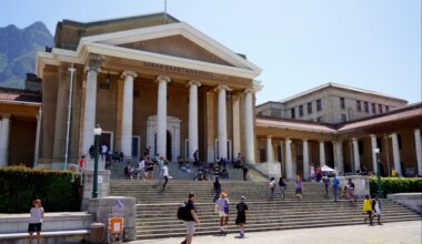 A city building with steps leading up to a classical portico