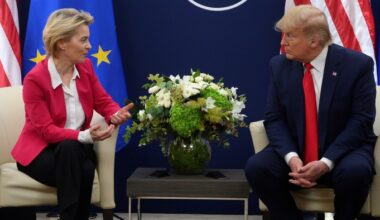 Donald Trump and Ursula von der Leyen sit facing each other in conversation