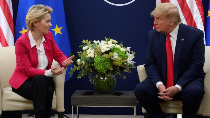 Donald Trump and Ursula von der Leyen sit facing each other in conversation