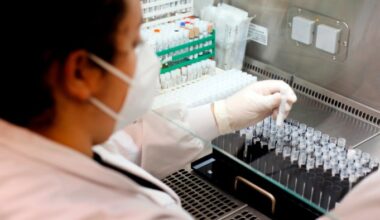 A health lab technician works at a Cerba laboratory in France