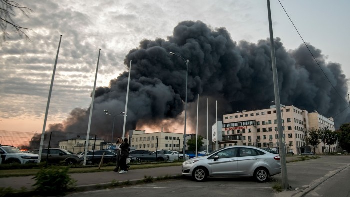 Clouds of smoke rise above the Ukrainian capital following an overnight attack in Kyiv