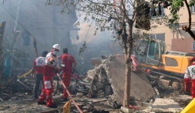 Rescuers work at the scene of an Israeli strike in Tehran