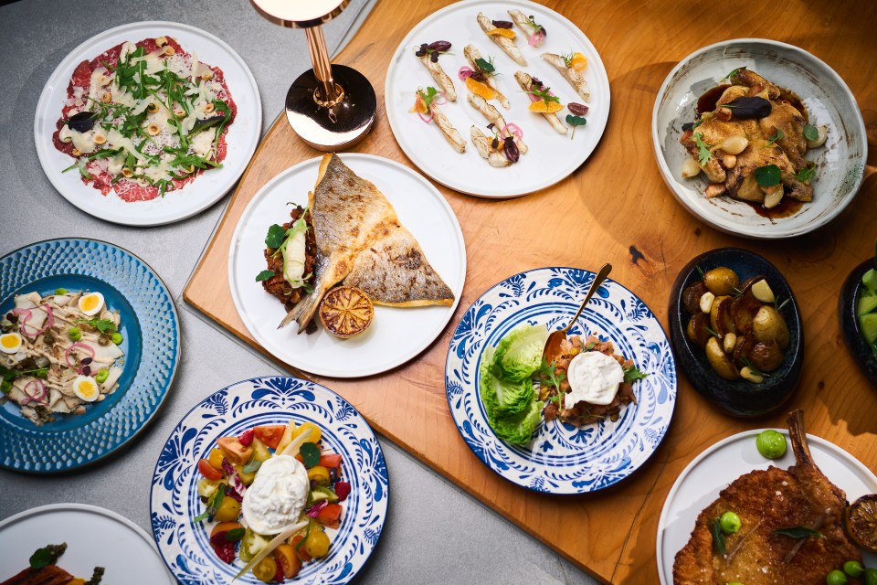 Overhead view of various dishes served on plates at Hyatt Malta.