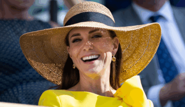 Kate Middleton wearing a yellow dress and sun hat smiling