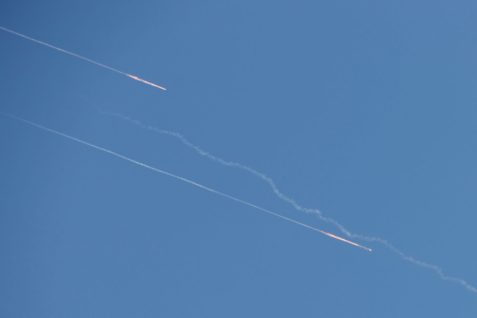 Missiles launched from Iran towards Israel are seen in the sky