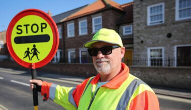 Lollipop man banned from giving children 'high fives' because it upsets drivers