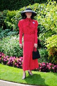ASCOT, ENGLAND - JUNE 17: Flora Macdonald Johnston (wearing a Lock & Co hat, The Irish Twin dress, Swaine bag and Manolo Blahnik shoes) attends the 1st day of Royal Ascot on June 17, 2025 in Ascot, England.  (Photo by Kirstin Sinclair/Getty Images for Royal Ascot 2025)