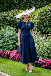 ASCOT, ENGLAND - JUNE 17: Phoebe Gregory (wearing an Amy Money millinery hat and Reformation dress) attends the 1st day of Royal Ascot on June 17, 2025 in Ascot, England.  (Photo by Kirstin Sinclair/Getty Images for Royal Ascot 2025)
