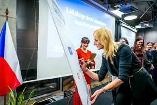 Signing OPIM's Ten Commandments. Photo: OPIM