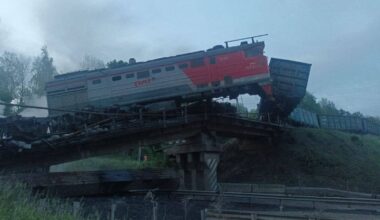 When a bridge collapsed in the Kursk region, part of the train fell down onto the road, and a fire started. Pic: RIA/Telegram