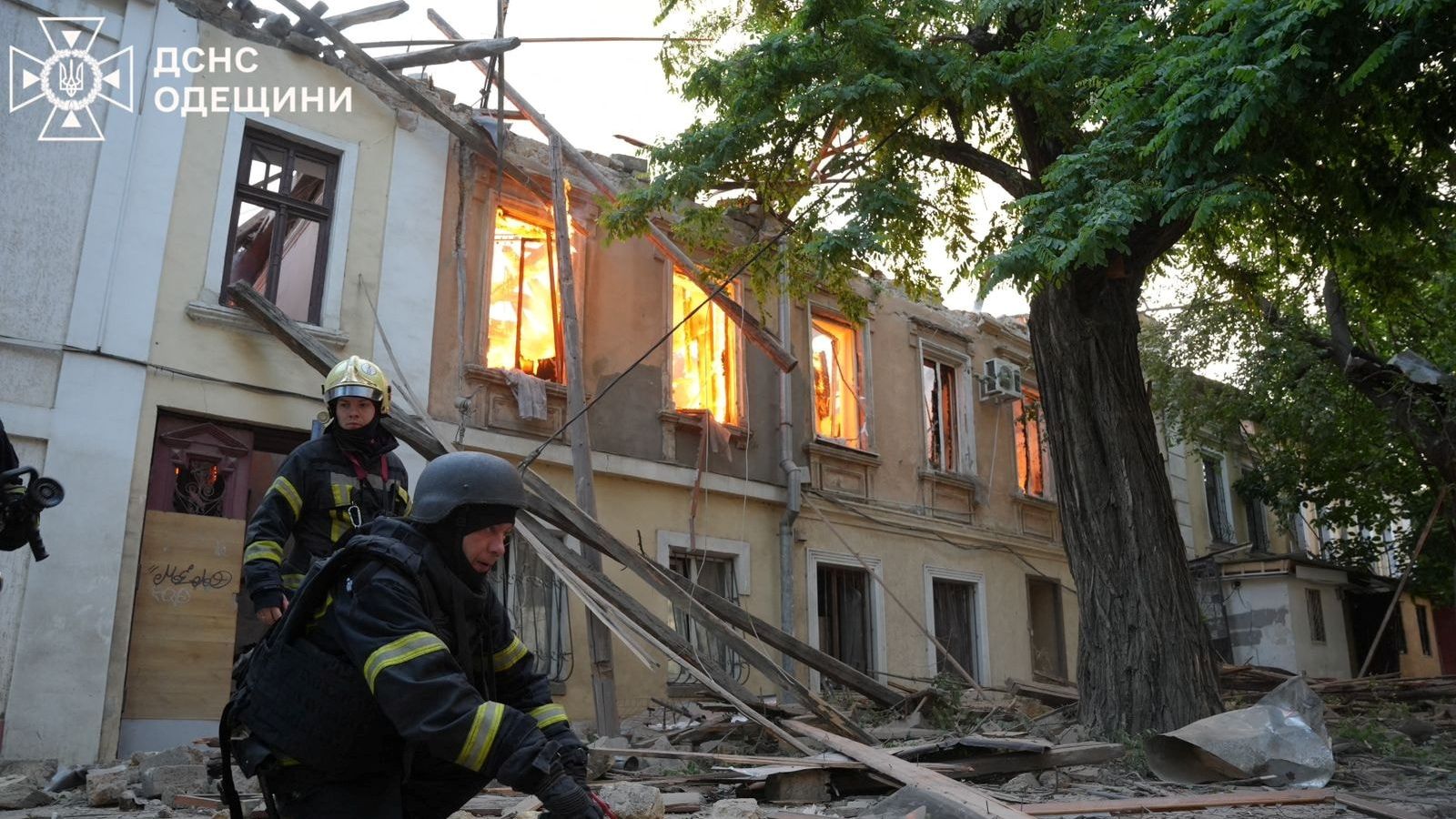 Firefighters work at the site of a Russian drone strike, amid Russia's attack on Ukraine, in Odesa, Ukraine in this handout picture released