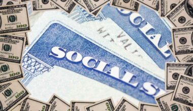 Social Security card encircled by hundred-dollar bills, symbolizing benefit-suspension risk in May 2025