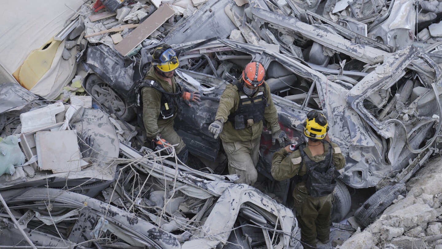 The Latest: Death toll grows as Israel and Iran trade attacks for third day