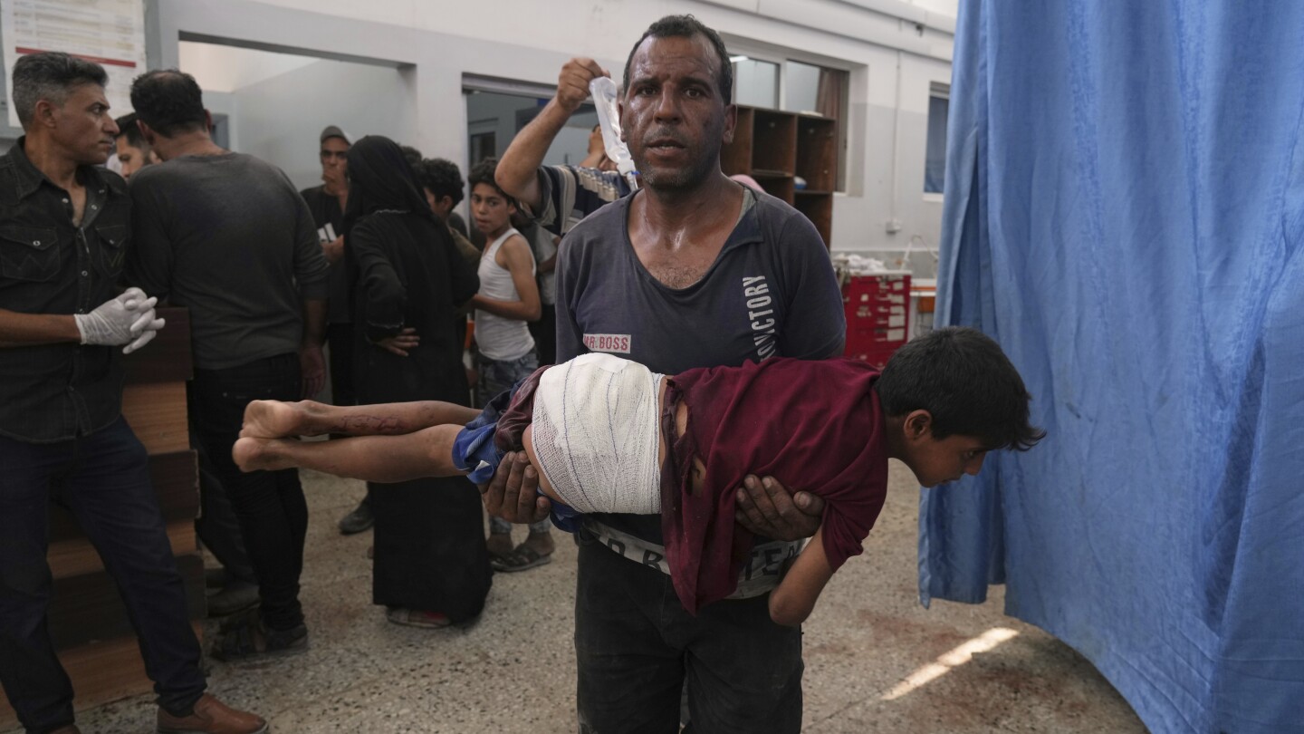 74 killed in Gaza as Israeli forces strike a cafe and fire on people seeking food