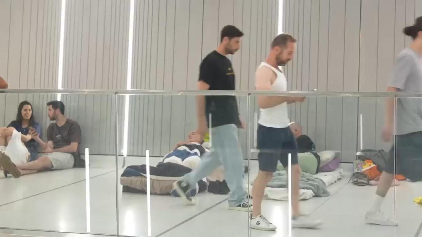 Fearful of Iranian missiles, hundreds sleep in underground train stations near Tel Aviv