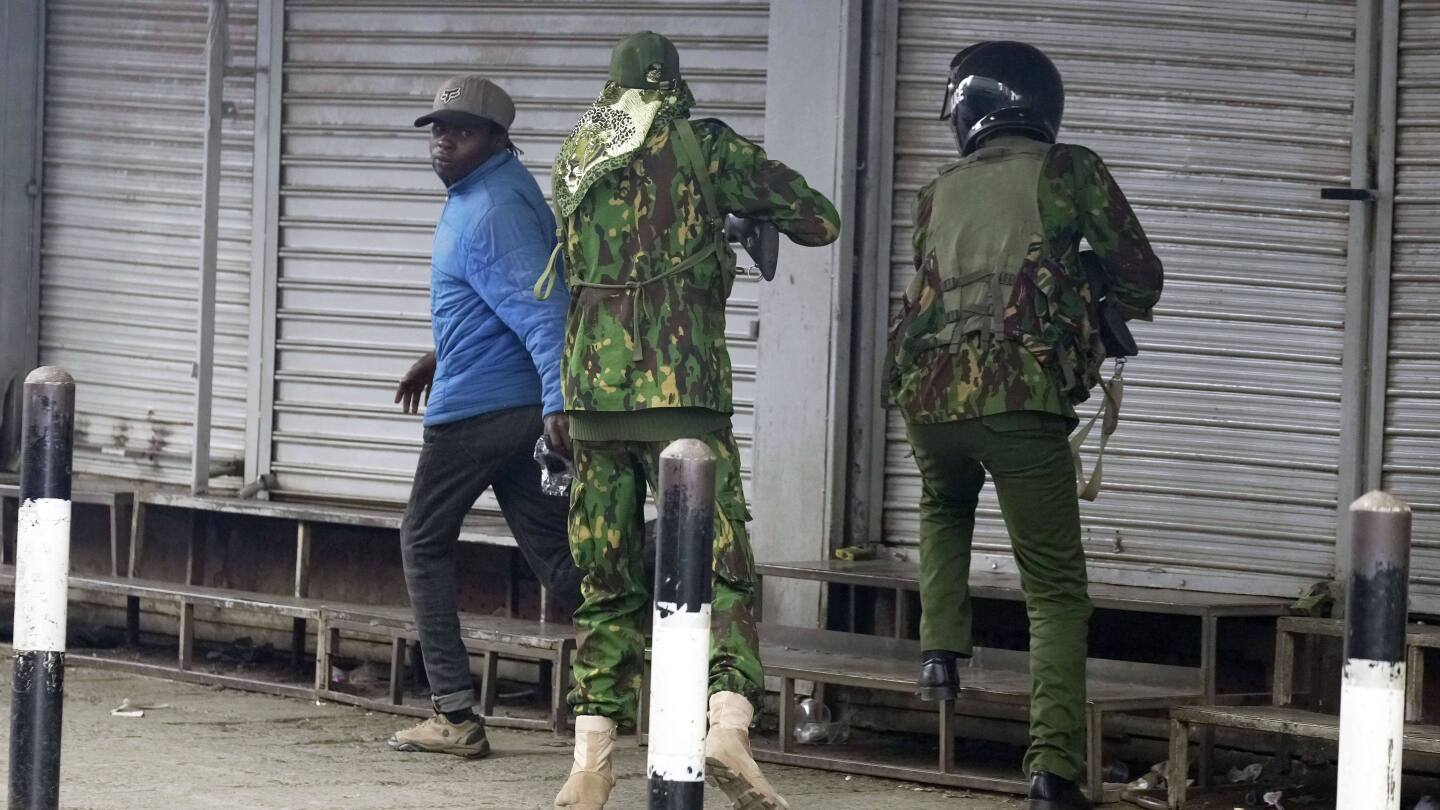 Photos show Kenyan police officer shooting a civilian at close range