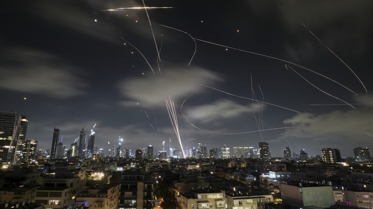 New Israeli strikes hit Tehran as Iran warns that U.S. involvement would risk 'all-out war'