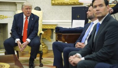 US says current visas from travel ban countries won't be revoked