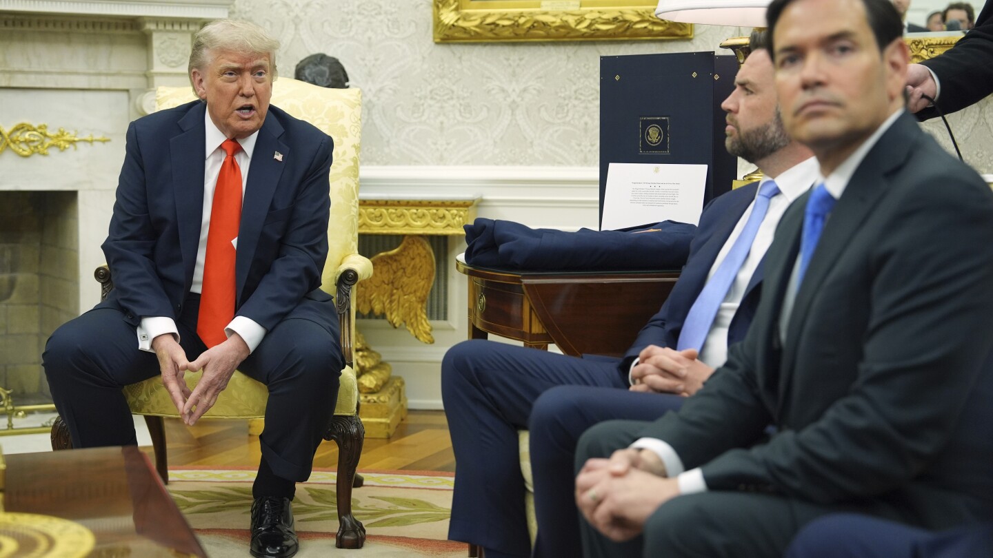 US says current visas from travel ban countries won't be revoked