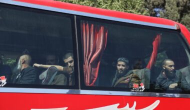 Syrian government and Kurdish-led force exchange prisoners in a step toward easing tensions