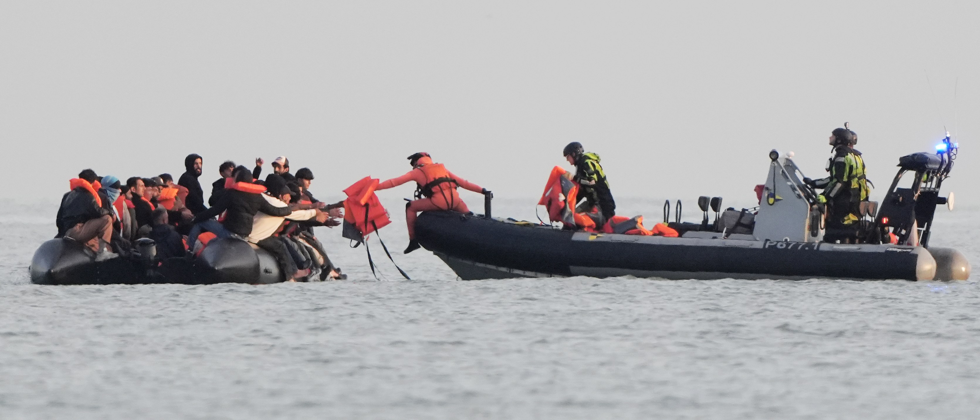 French authorities intercepting a migrant boat.