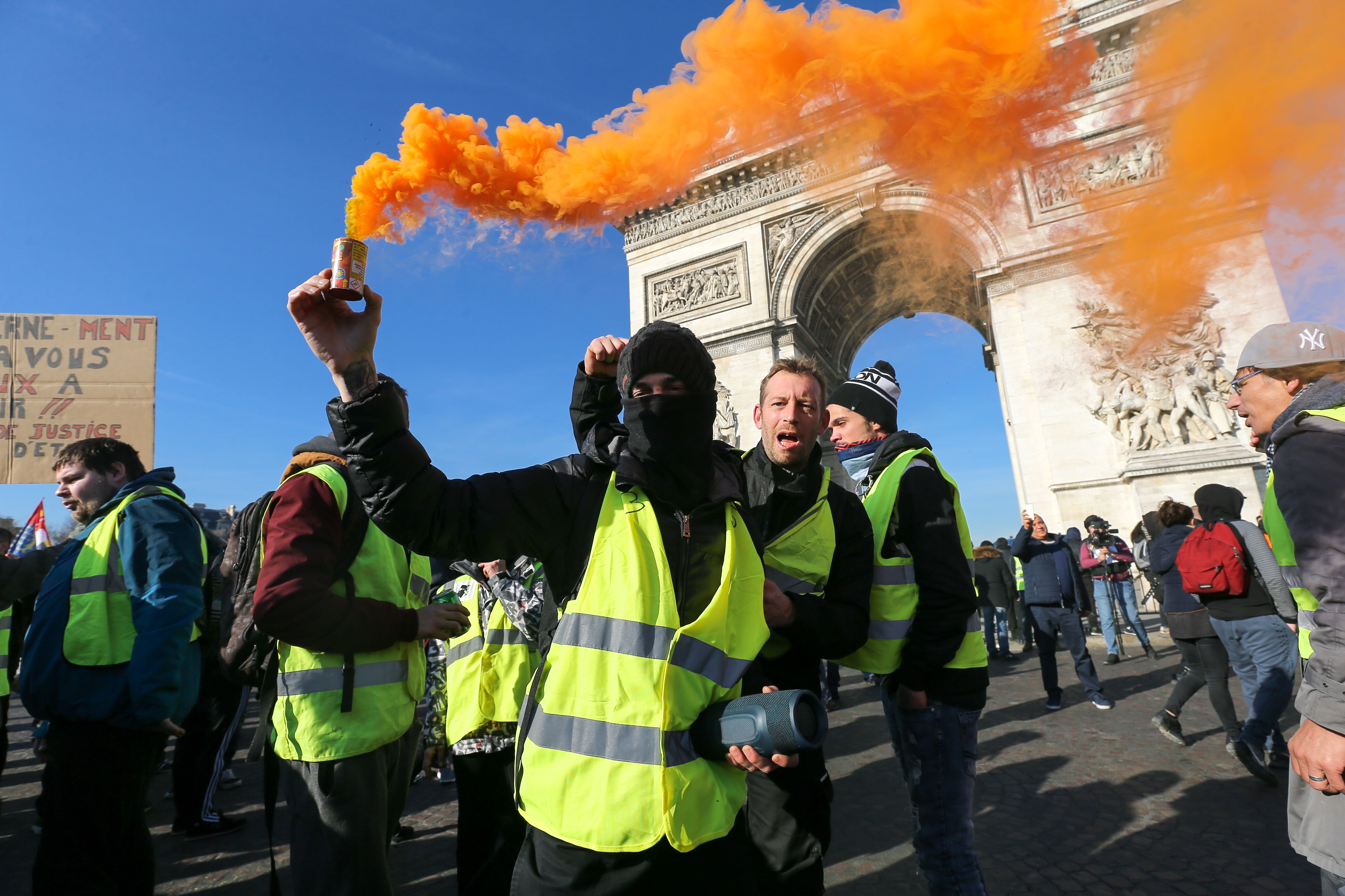 Yellow vest protesters in Paris demonstrating near the Arc de Triomphe.