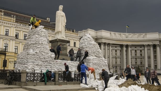 Volunteers cover a monument of the Princess Olga, Apostle Andrew, Cyril and Methodius of sand bags for protection as Russia's invasion of Ukraine continues, in historical center of Kyiv, Ukraine March 29, 2022 (Photo by Maxym Marusenko/NurPhoto via Getty Images)