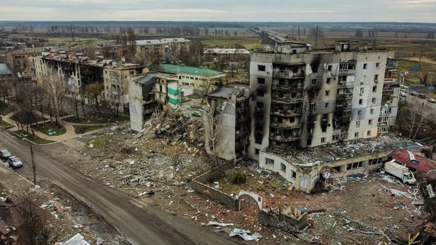 This aerial view taken on April 6, 2022 shows a destroyed residential building in the town of Borodianka, northwest of Kyiv, on April 6, 2022, during Russia's military invasion launched on Ukraine. - The Russian retreat last week has left clues of the battle waged to keep a grip on Borodianka, just 