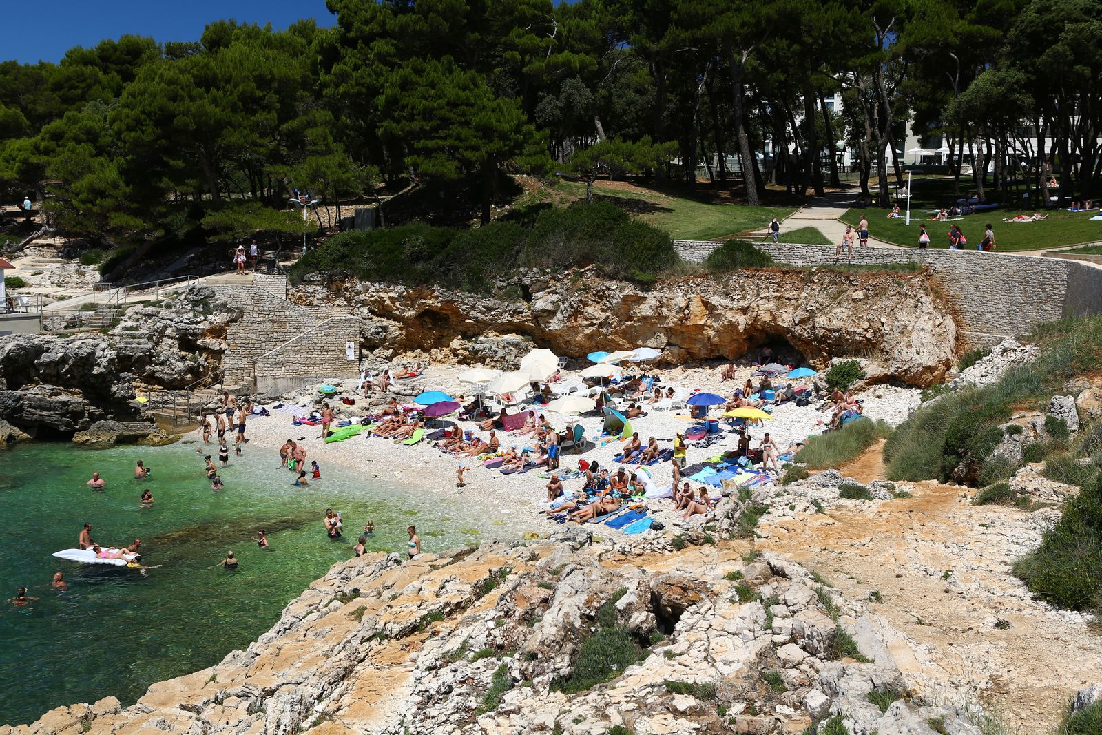 Image may contain Rock Summer Nature Outdoors Sea Water Beach Coast Shoreline Person Leisure Activities and Sport