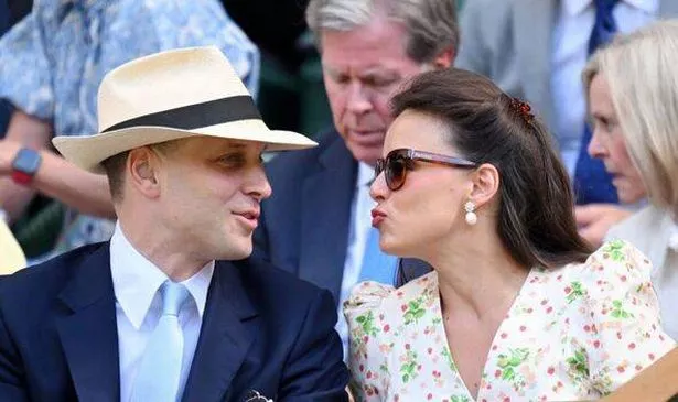 Sophie Winkleman making a kissing gesture at her husband at Wimbledon