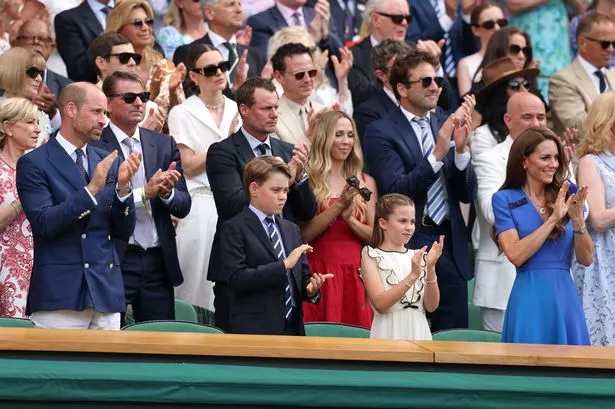 Prince William, Prince George, Princess Charlotte and Catherine applaud from the Royal Box prior to the Gentleman's Singles Final 2025