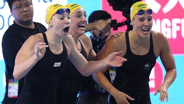 From left to right: Mollie O'Callaghan, Meg Harris and Milla Jansen celebrate Australia's win as Olivia Wunsch closes out the relay.
