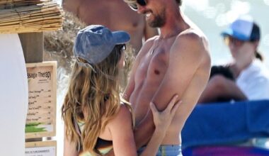 Abbey Clancy and Peter Crouch put on a very loved-up display as they spent the day at the beach during their family holiday to Almancil, Portugal