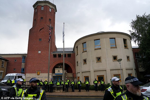 Officers line the streets outside Epping Forest District Council before protesters arrived ahead of the council meeting