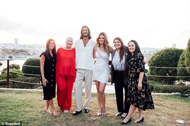Delta also ended her wedding week at the award-winning destination with a sentimental, sunset photo of her family and friends in the landscaped gardens