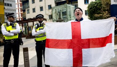 Asylum seekers could be made homeless if they refuse Home Office demands to move accommodation, the Government has warned (Pictured: A protestor outside a hotel in East London this week)