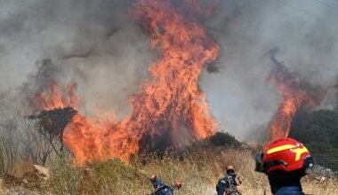 Firefighters try to extinguish flames on the island of Kythira, Greece this weekend. Wildfires are burning through the night in Eastern Europe with more than 50 blazes in Greece alone