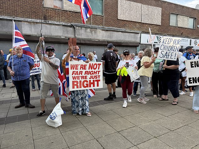 People holding placards saying: 'We are not far right we are just right'