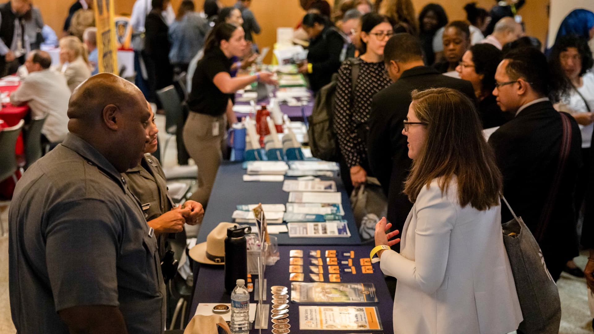 Jobseekers talk to recruiters during the New York Public Library's annual Bronx Job Fair & Expo at the Bronx Library Center in the Bronx borough of New York, on Sept. 6, 2024.